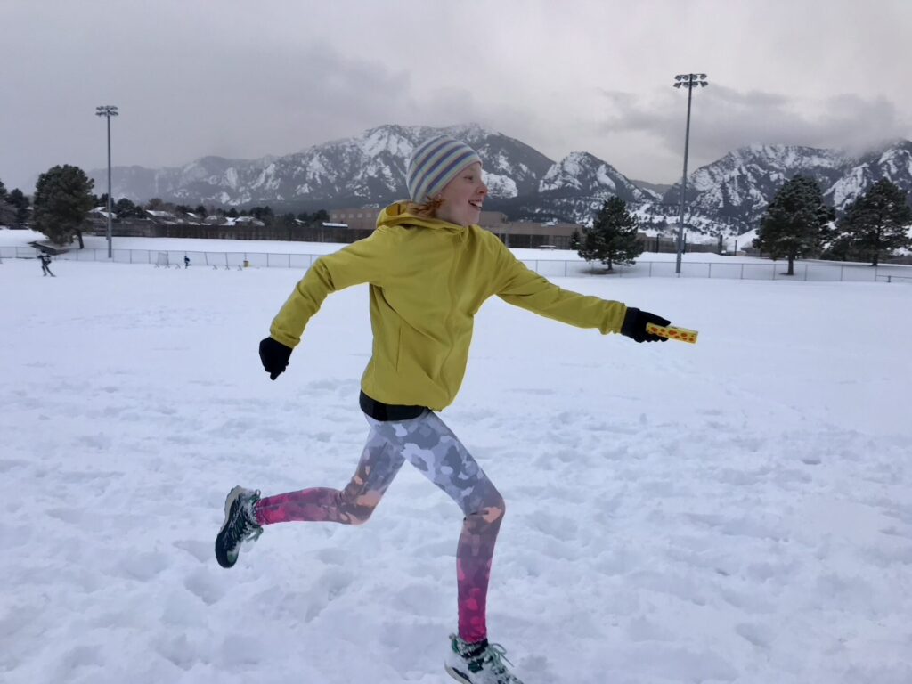 Girl Running in Snow